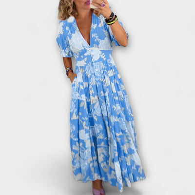 Catrisa – Bloemenprint jurk met V-hals en zakken